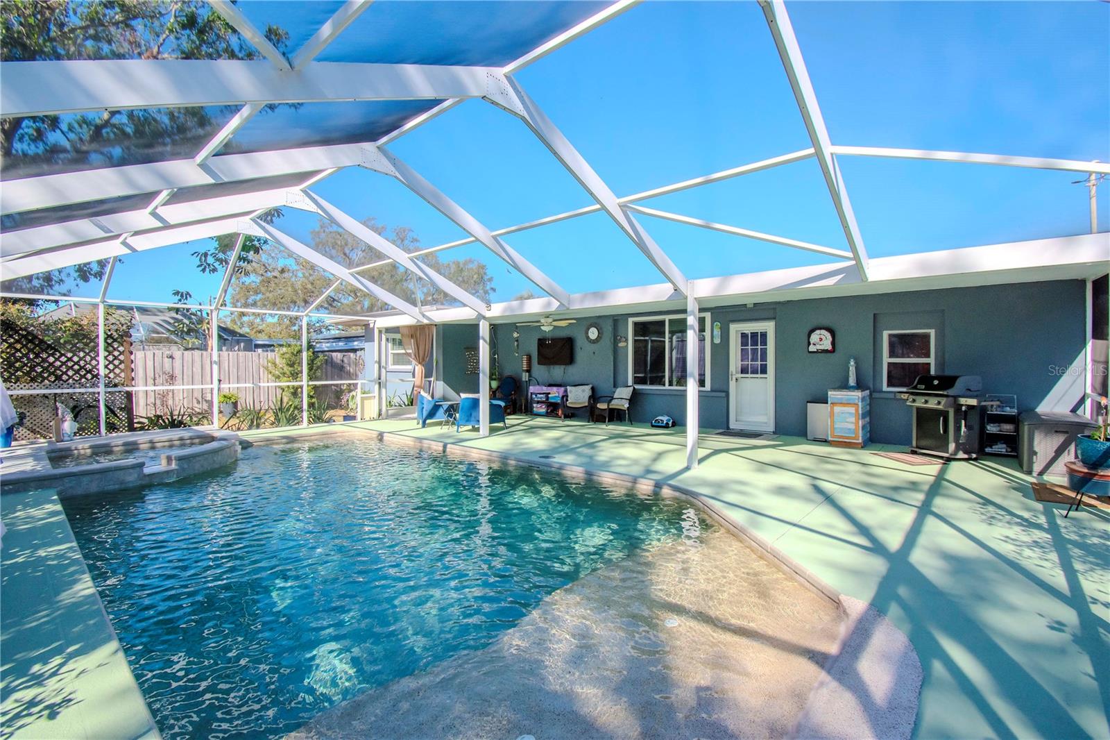 Pool area and covered back porch.