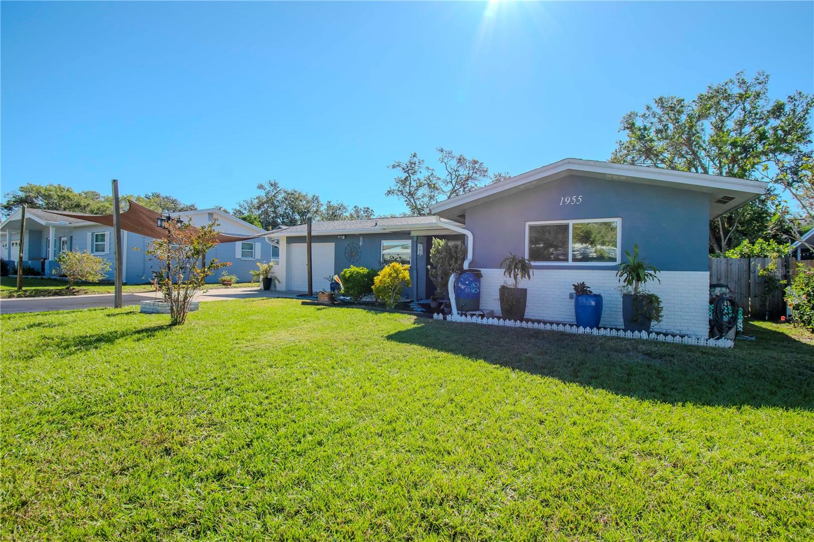 Additional view of the entire front of home and yard