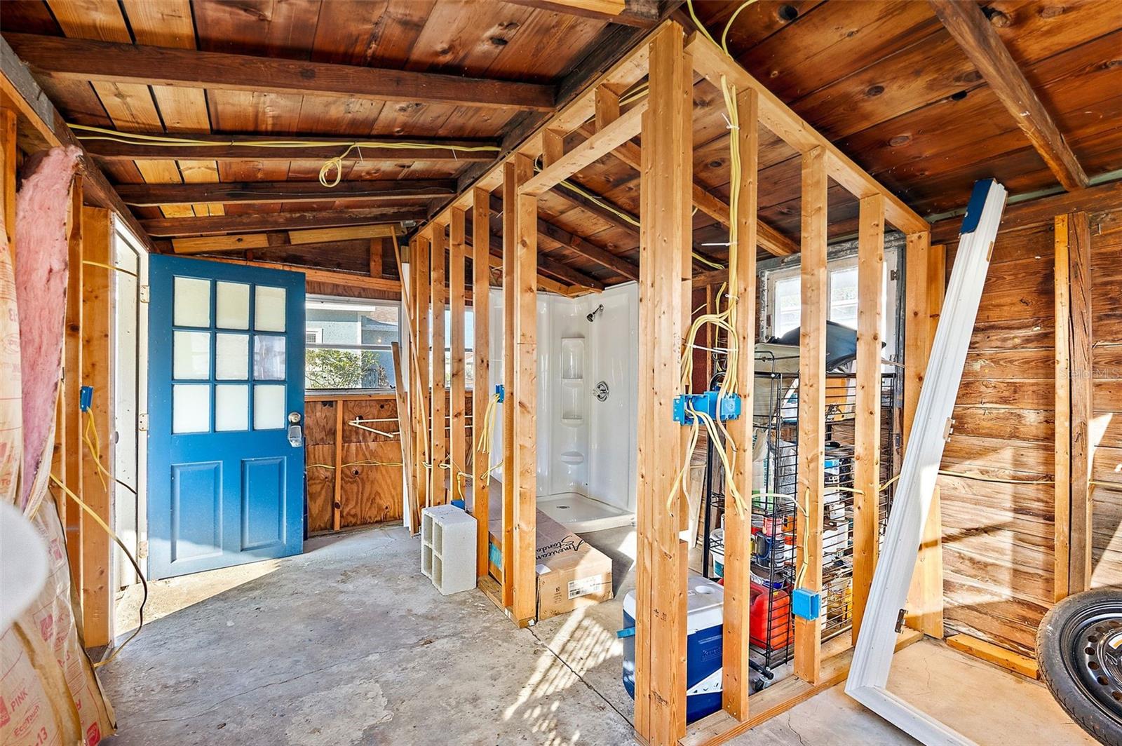 Partially finished garage, pre-plumbed + electric connected, ready for finishing touches!