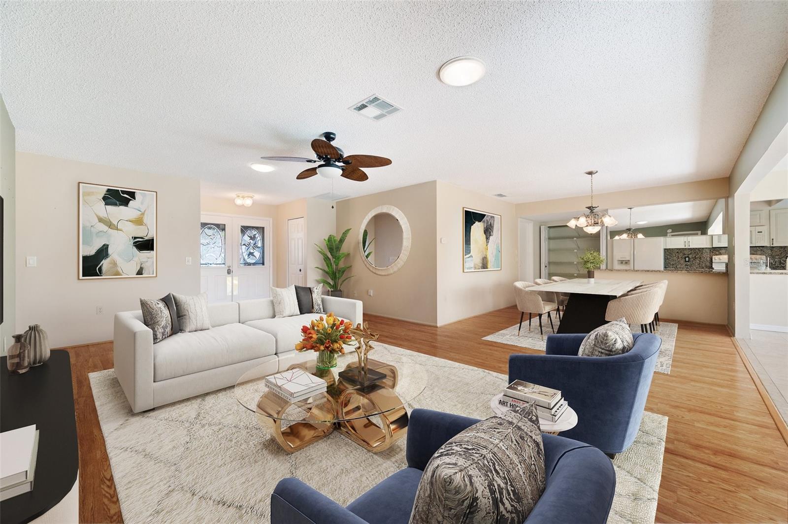 Staged view of living room and dining room