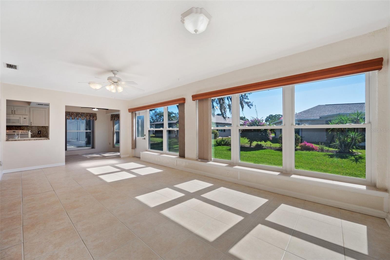 Family room with view of kitchen, breakfast nook nd backyard