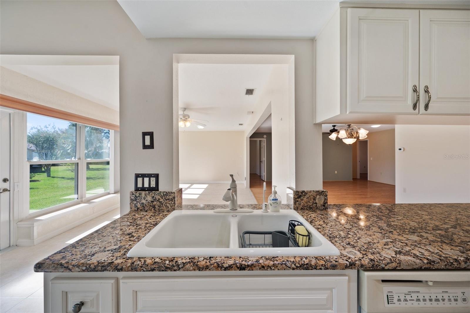 Showing pass thru areas of kitchen to family room and dining room