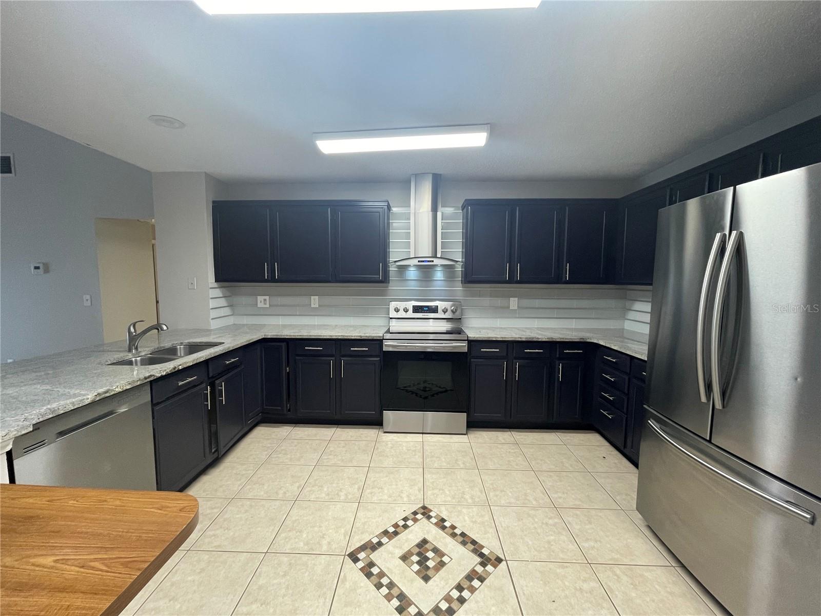 Kitchen with custom tile work