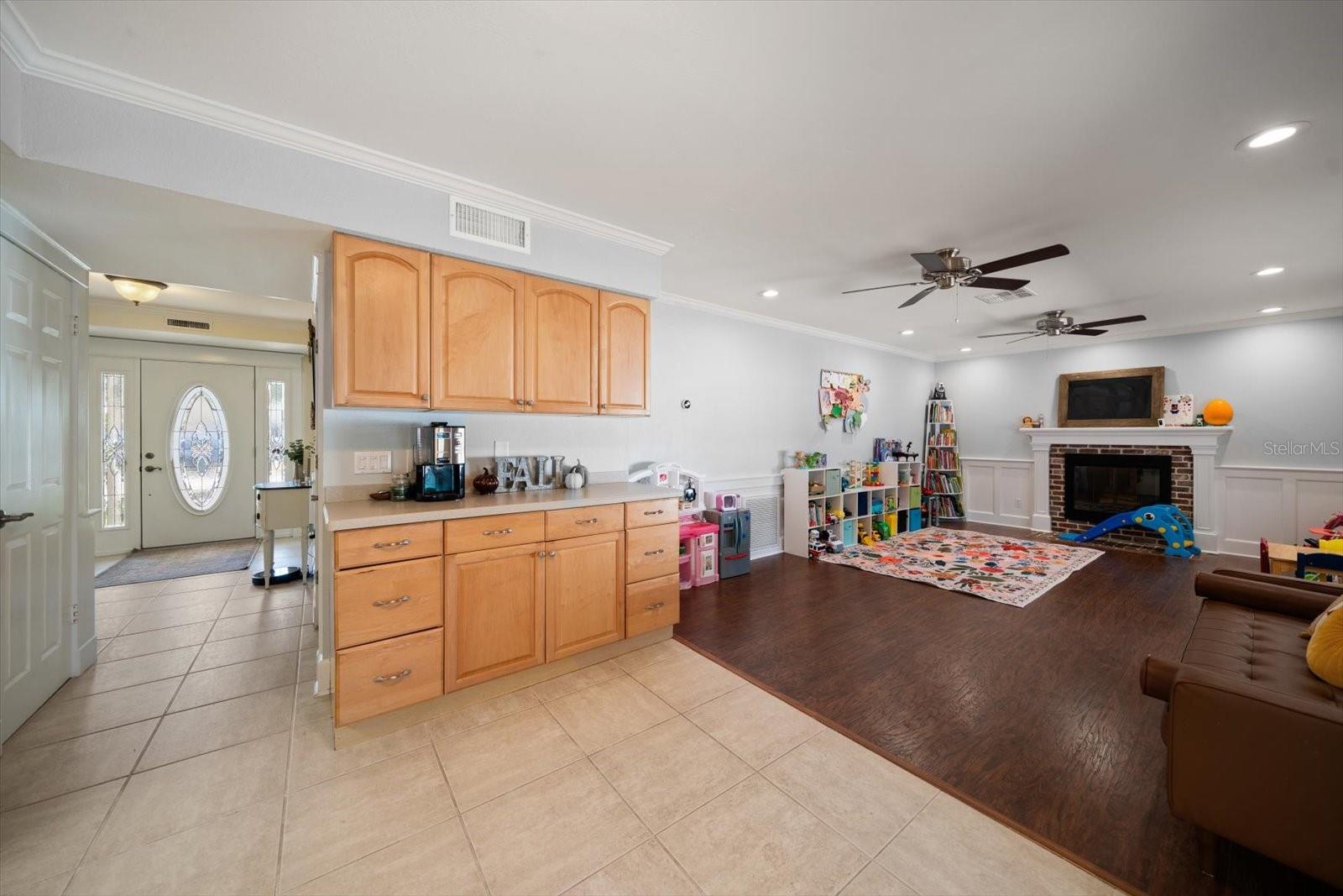 Enjoy the family room area with its beverage center and inviting fireplace.