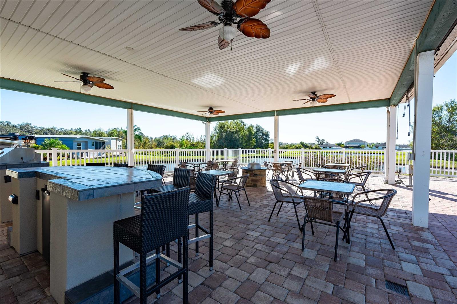 Community cabana has a built-in barbeque pitt and overlooks community pond.