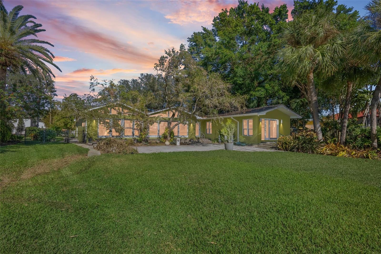 Large backyard leads to dock and bay