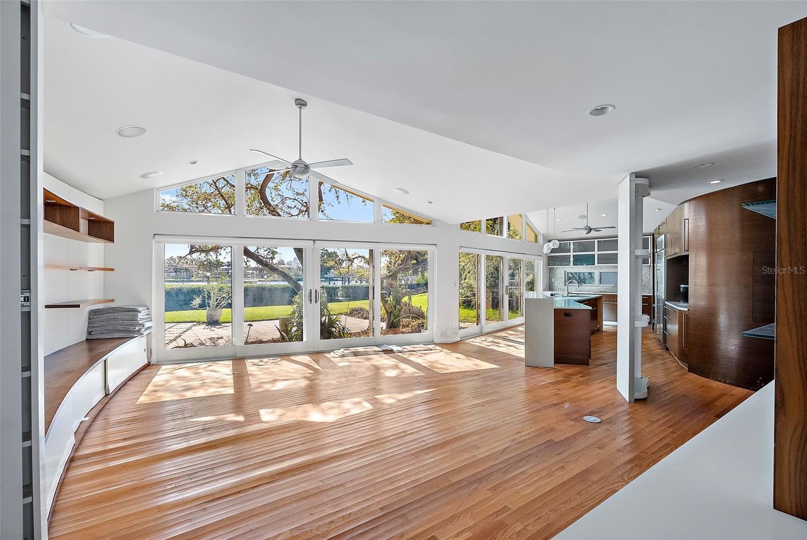 Large dining room with sliders to front patio. Floor must be replaced