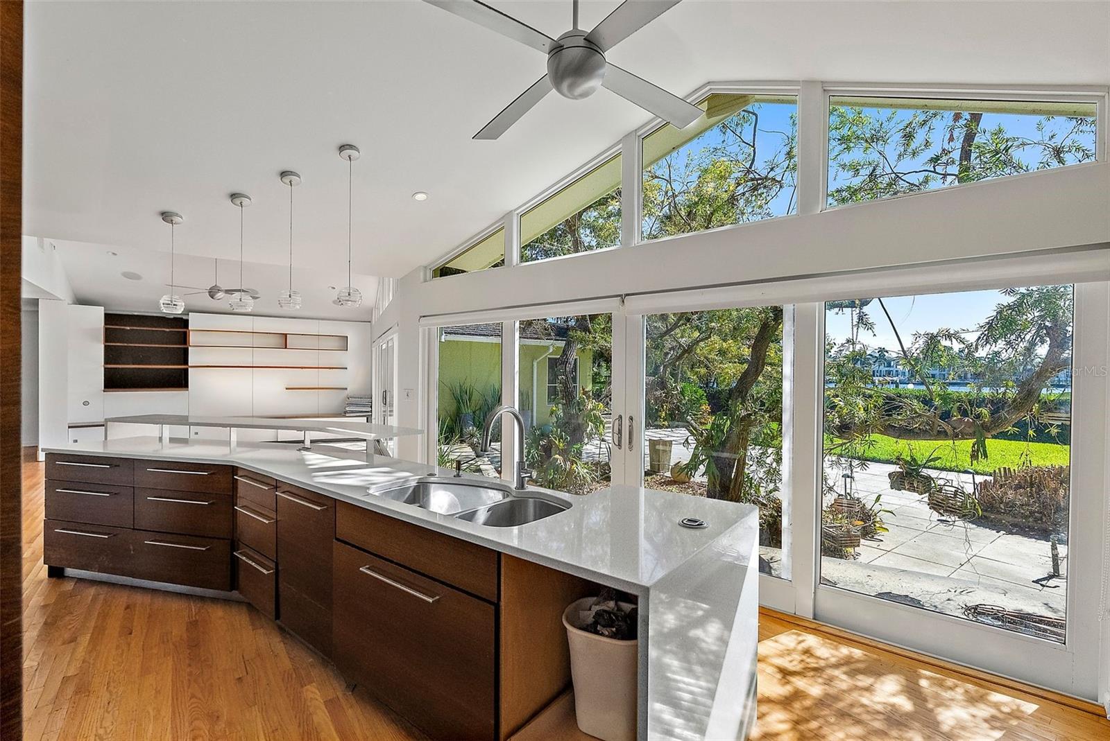 Quartz countertops on huge island. Fabulous light filled room with a water view.