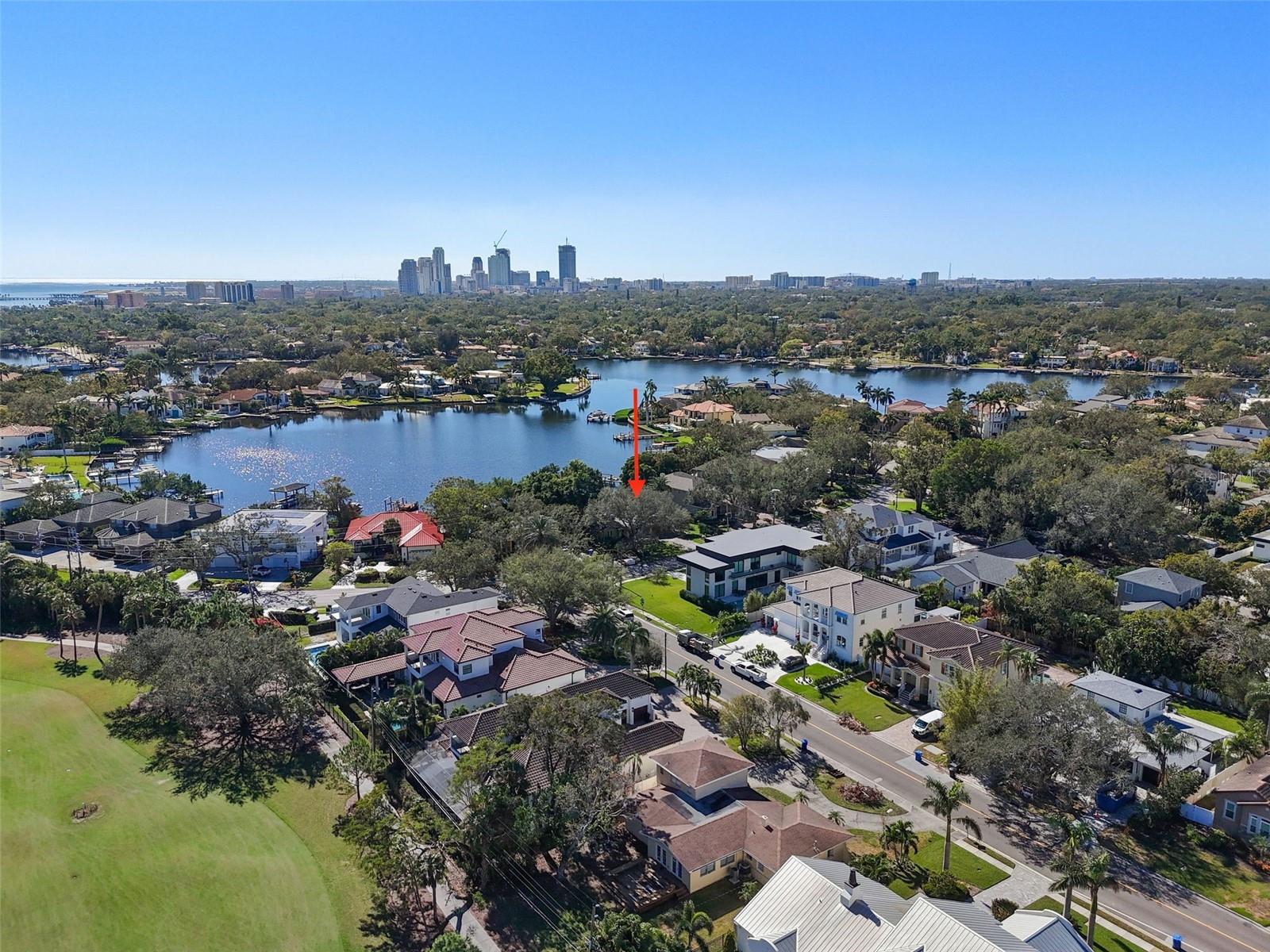 Overhead view of home, backyard, dock, and bay