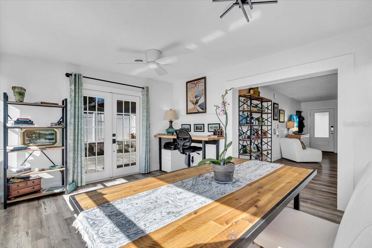 Sunroom with all day sun.  Outside backyard entrance.  Great for an office, dining area or add French doors and make this a three bedroom home.