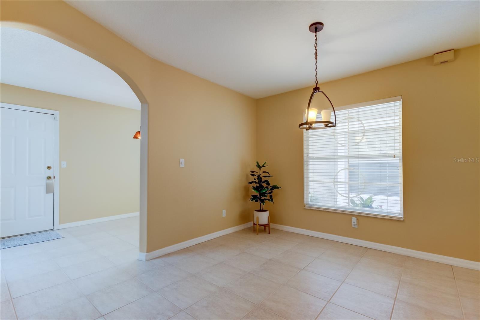 19. Traditional Dining Room (10' x 12').. Or FLEX Space Since There's a Spacious Breakfast Nook Through the Arch, Abutting the Kitchen!