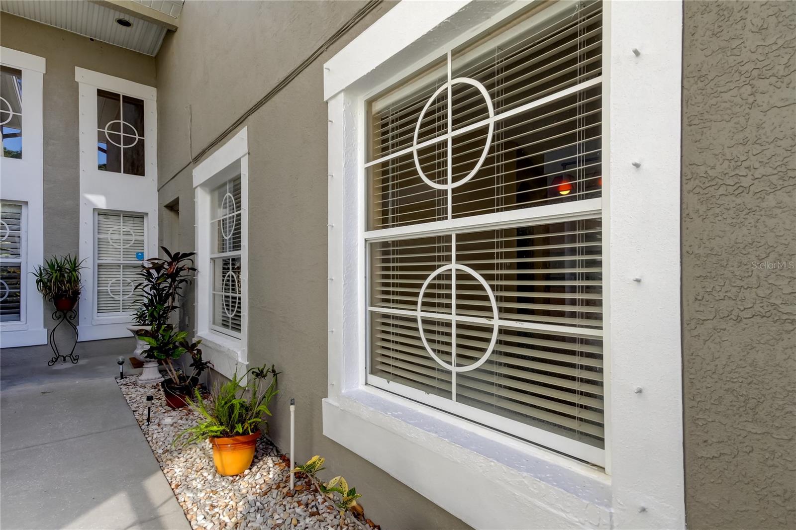 3. Guests Enter via a Wide Shared Entryway - Aligned w Potted Pants..