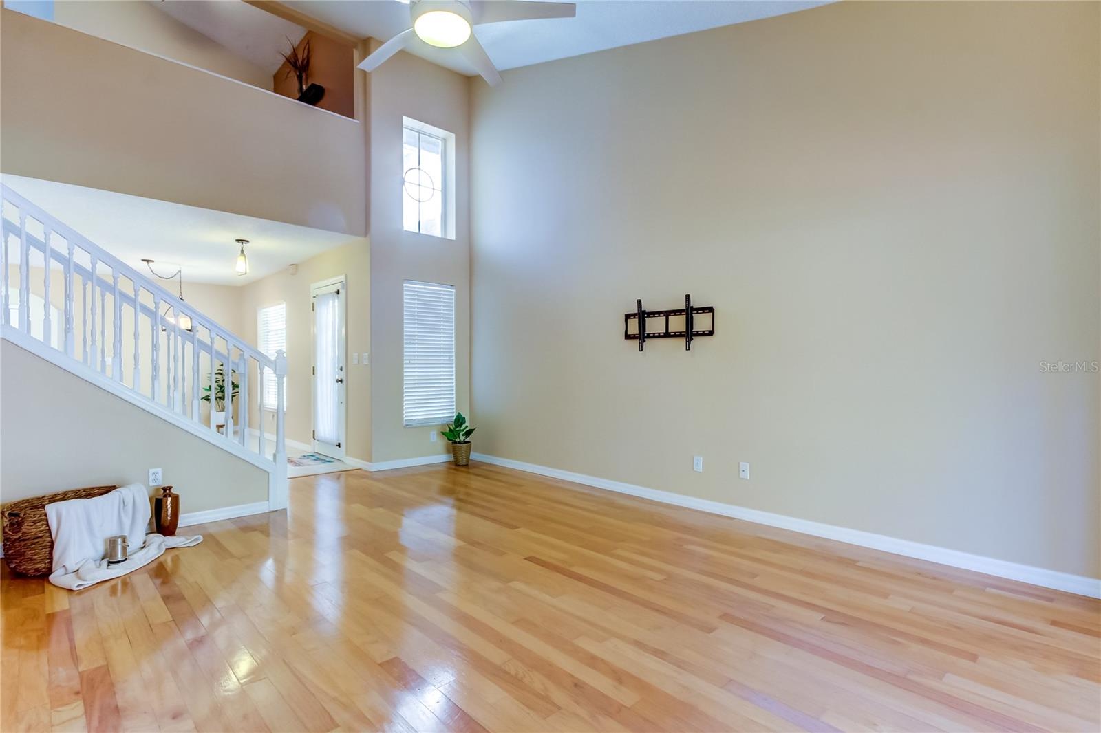 36. Living Room (13.5' x 19.6') w High Ceilings .. Loads of Natural Light Flood in from Multiple Sources.. A GREAT Space for 'Living' - TV Bracket is Already Installed!