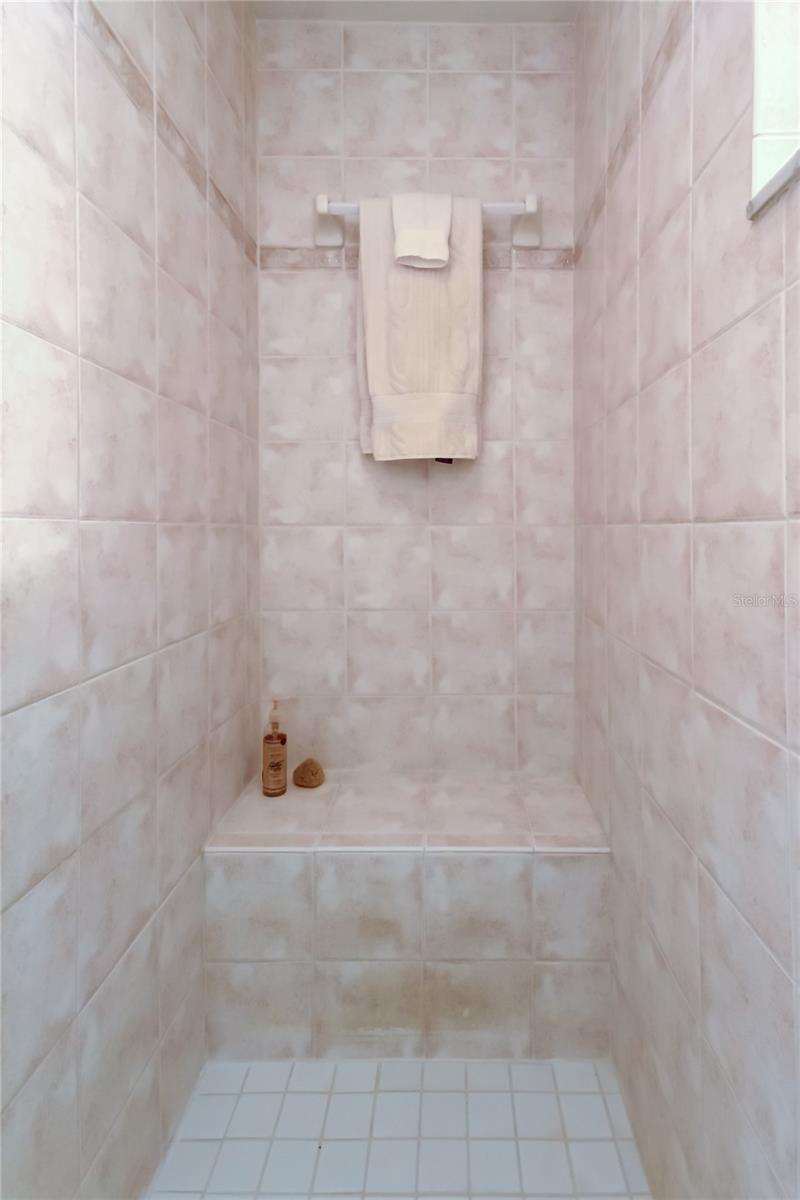 49. Owner's Retreat En Suite Bathroom w Oversized Walk in Shower.. w Built in Bench, Towel Bar, Shelf Under a Glass Partition.. Plus Rec Light Overhead!