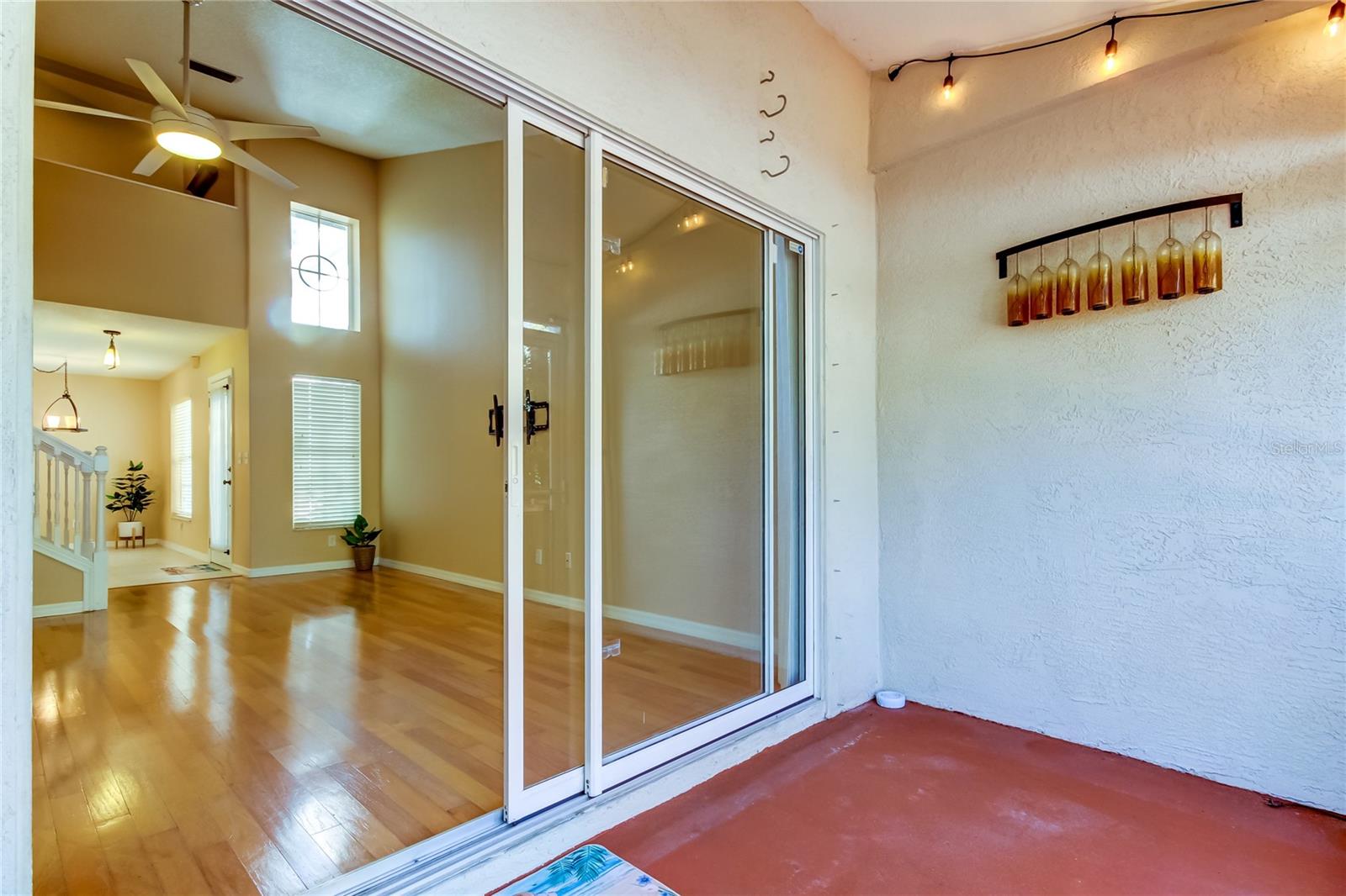 74. Partially Enclosed Lanai (6.9' x 11.5') w/ Vault Ceiling & A++ View of Brooker Creek! See the HOOKS? Those are for Your Fishing Rods!!