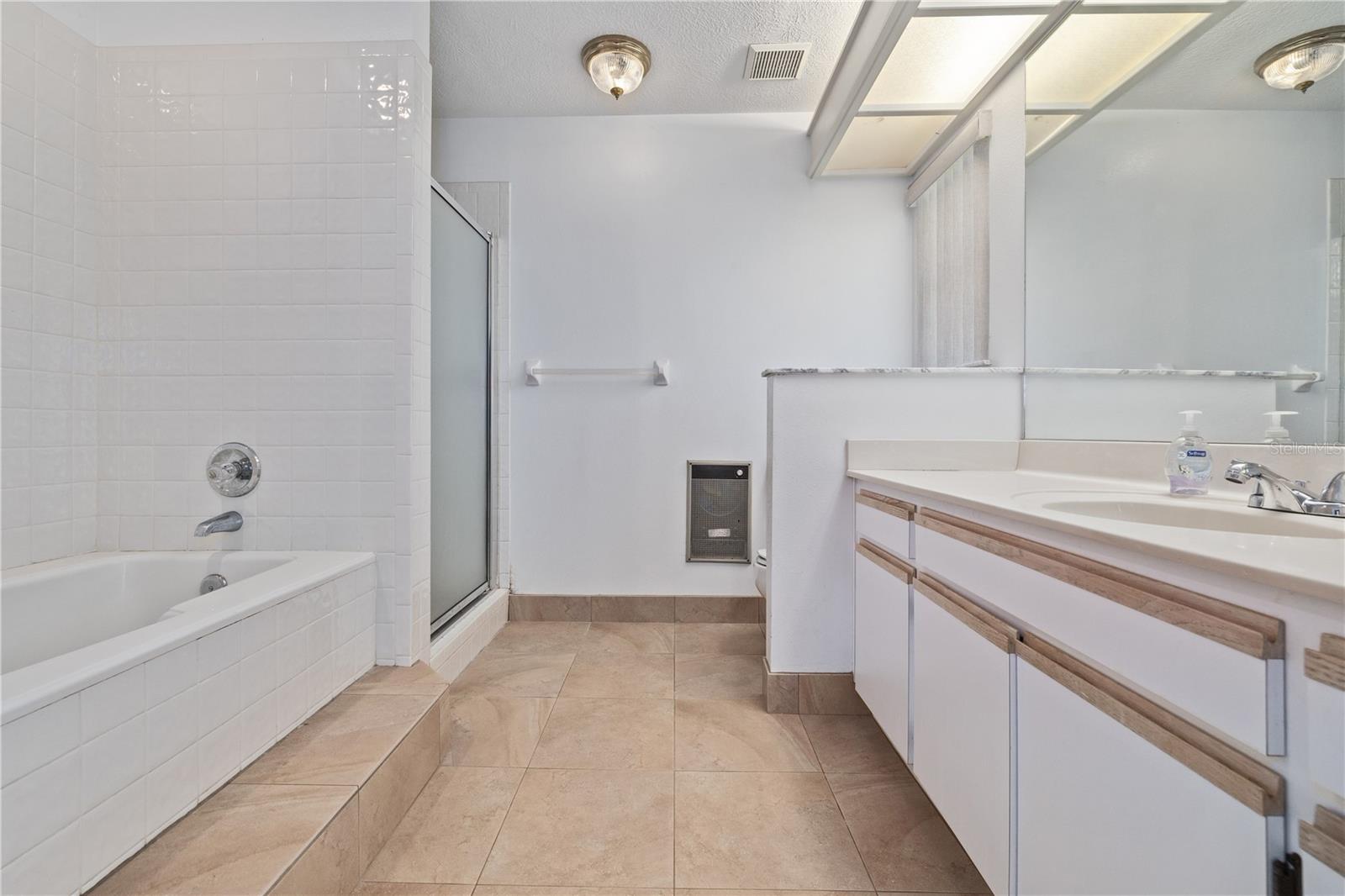 Primary Bathroom with Separate Tub and Shower