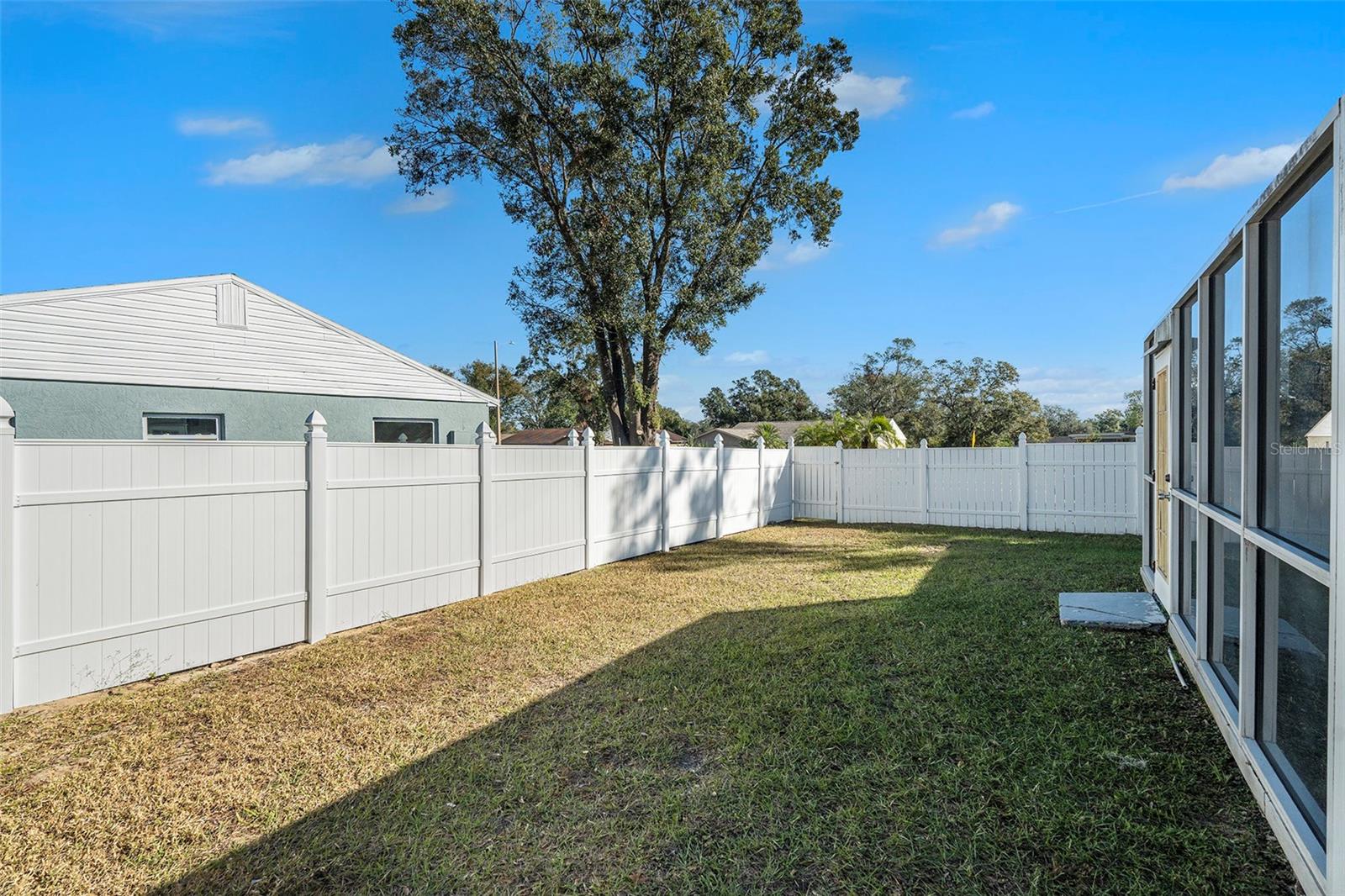 Back yard view with Florida room