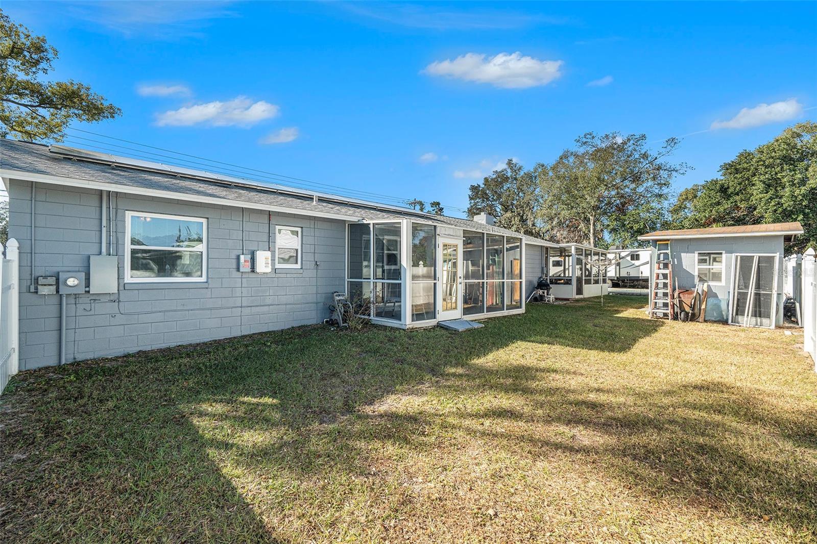 Back yard view with Florida room