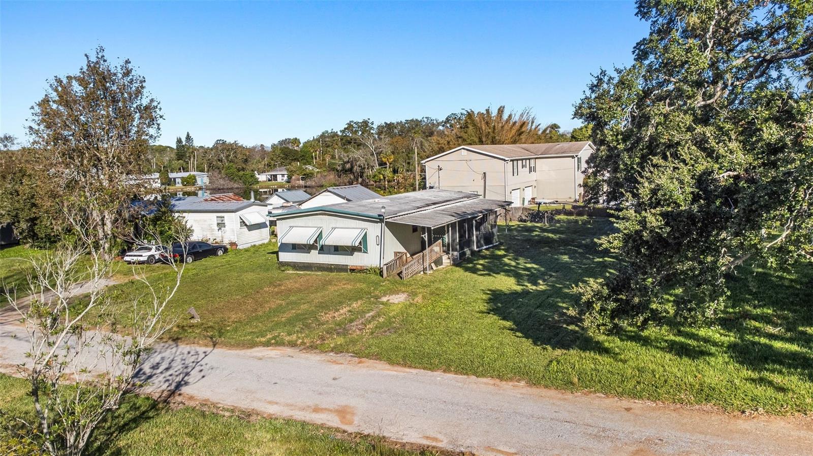 Carport collapsed during Hurricane Milton and virtually removed from this photo to show the property better.