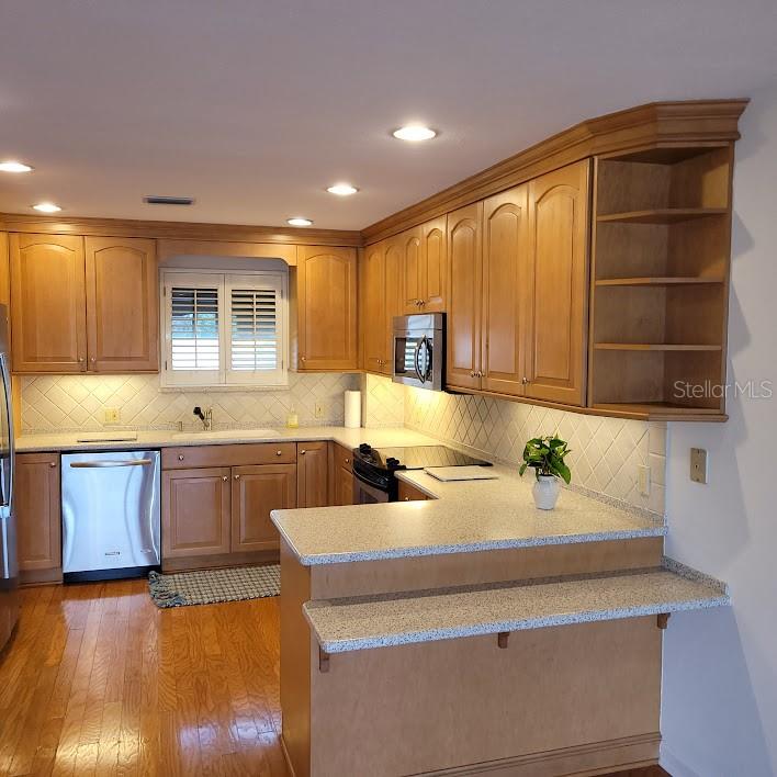 Breakfast counter, lots of cabinets and storage space to work with.