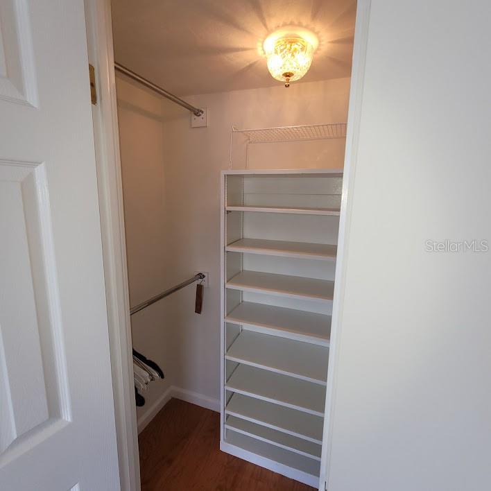 The 2nd closet offers more shelving and clothes hanging.