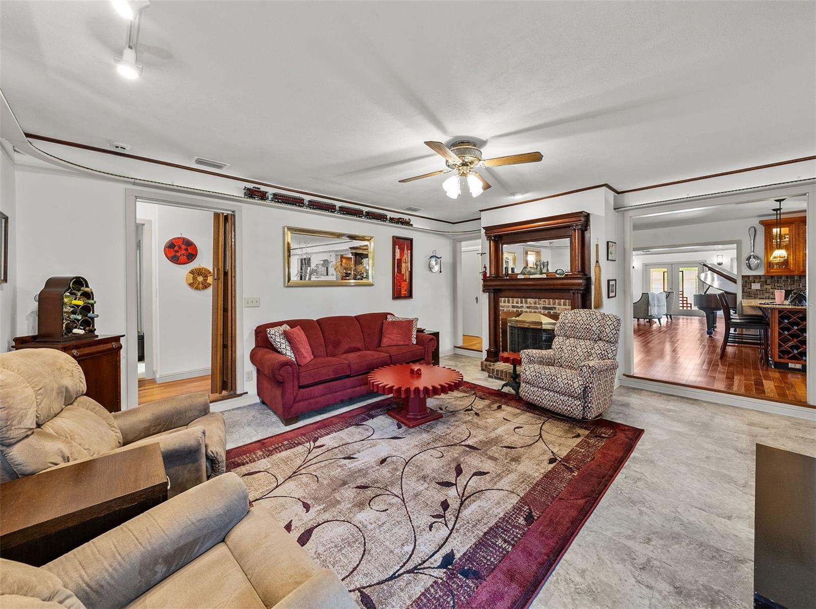 Family room with fireplace and custom built model train track that goes around the room