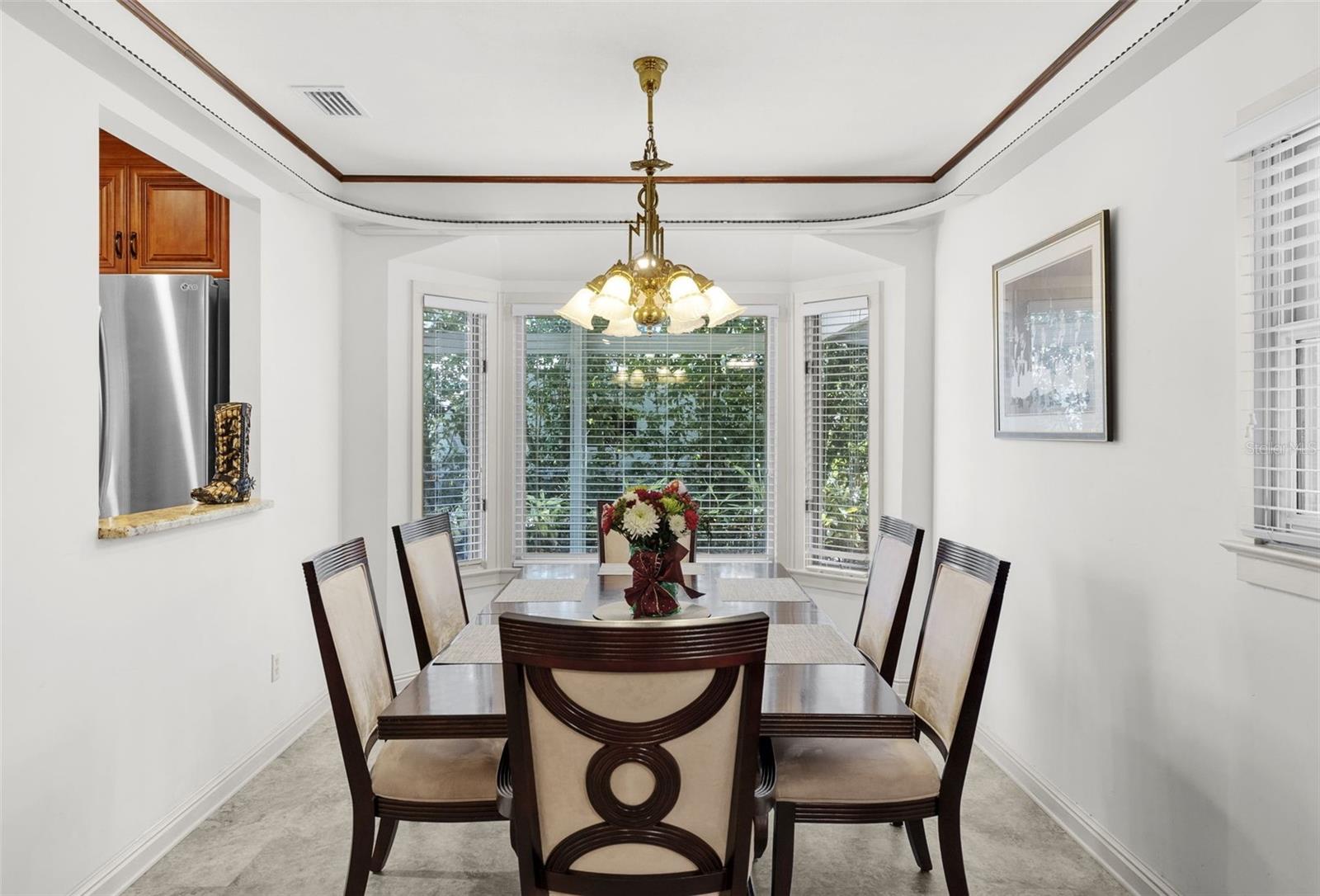 Dining room with a pass-through window from the kitchen