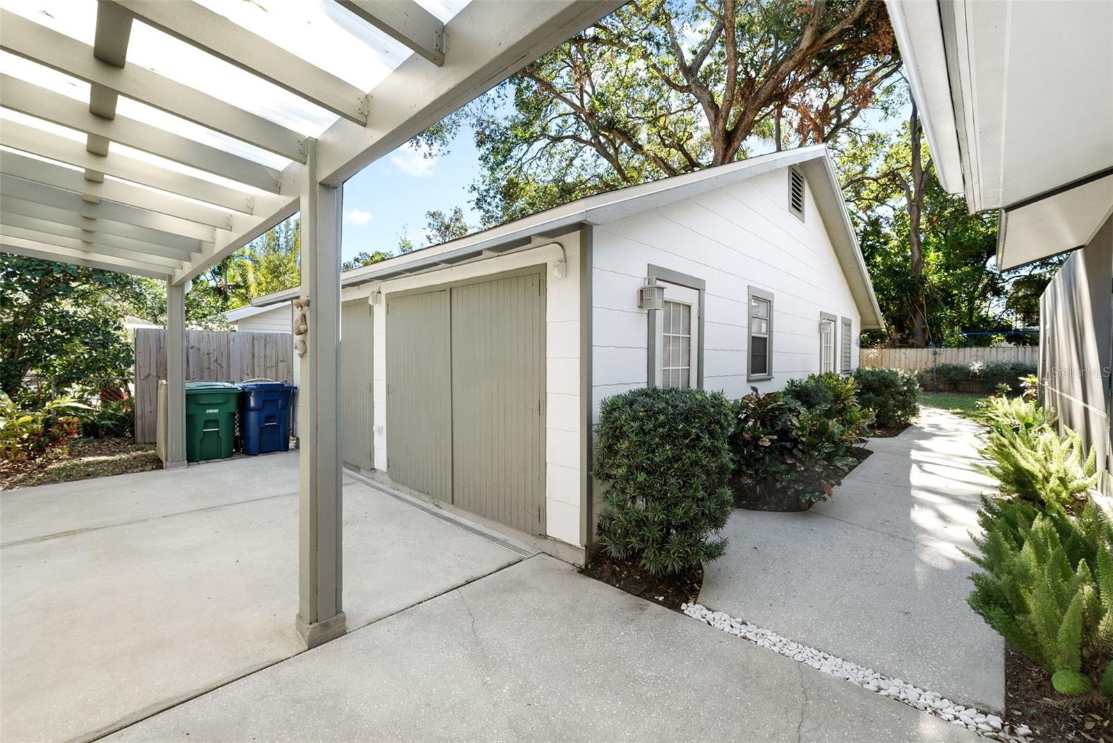 View of carport, workshop and additional storage space