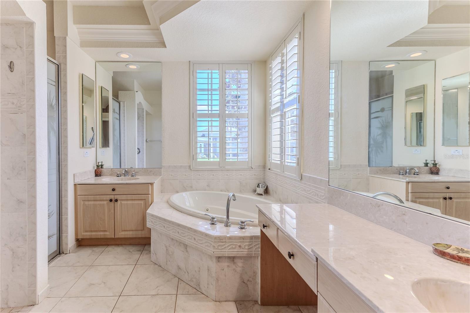 Elegant Owner's Bathroom with His and Her Vanities + Jacuzzi Tub & Walk in Shower