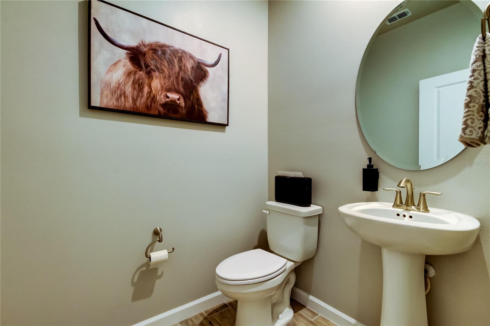 The Powder Room downstairs offers convenience and privacy.