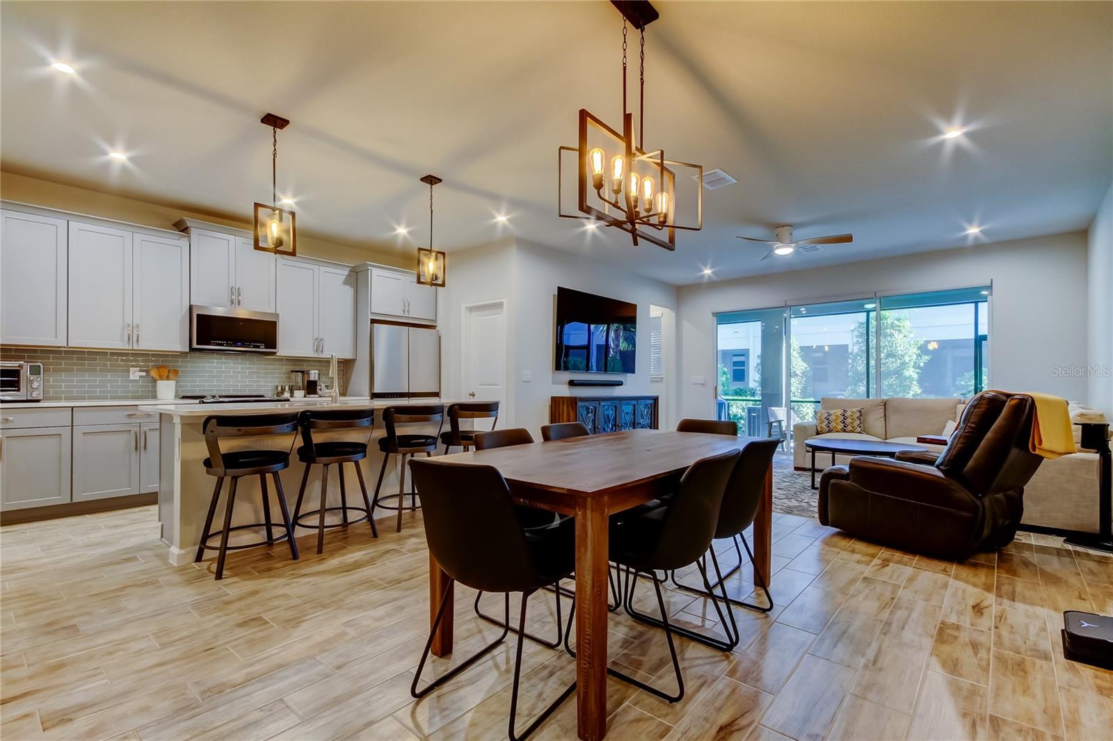 Designer kitchen with abundant cabinet space and a center island with a breakfast bar