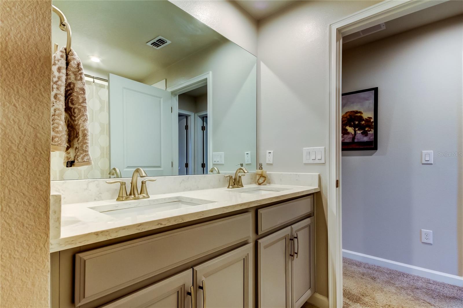 Bathroom #2 with dual under counter sinks between Bedroom #2 and bedroom #3.