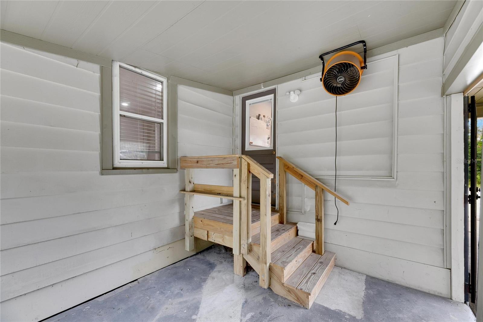 Rear porch connect to laundry and backyard