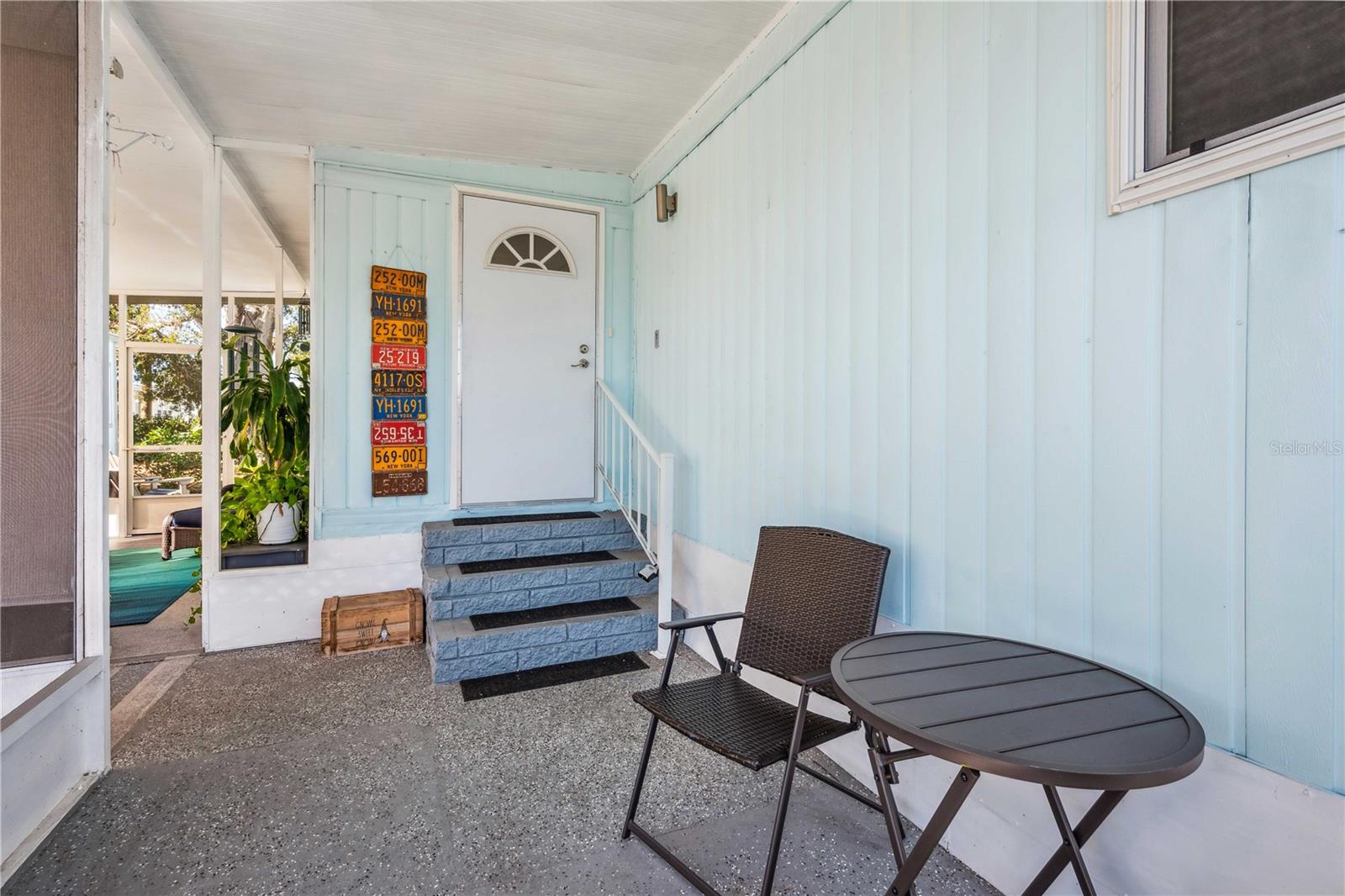 Front entry into home from carport.