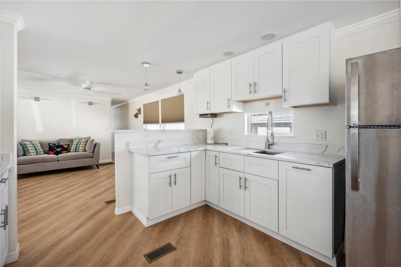 Kitchen is open with living room.