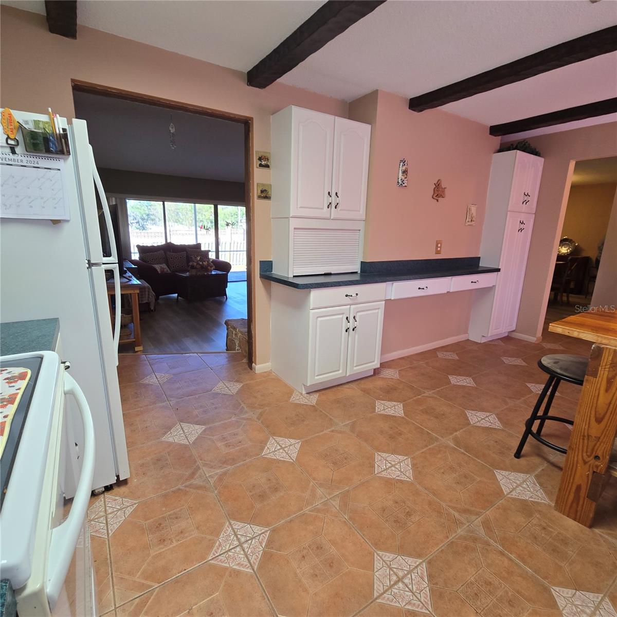 Lots of cabinets in kitchen for storage including an appliance garage and pantry