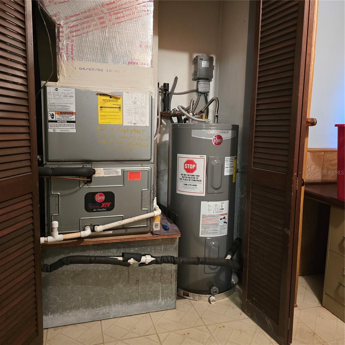 Air handler and water heater located in extra garage room