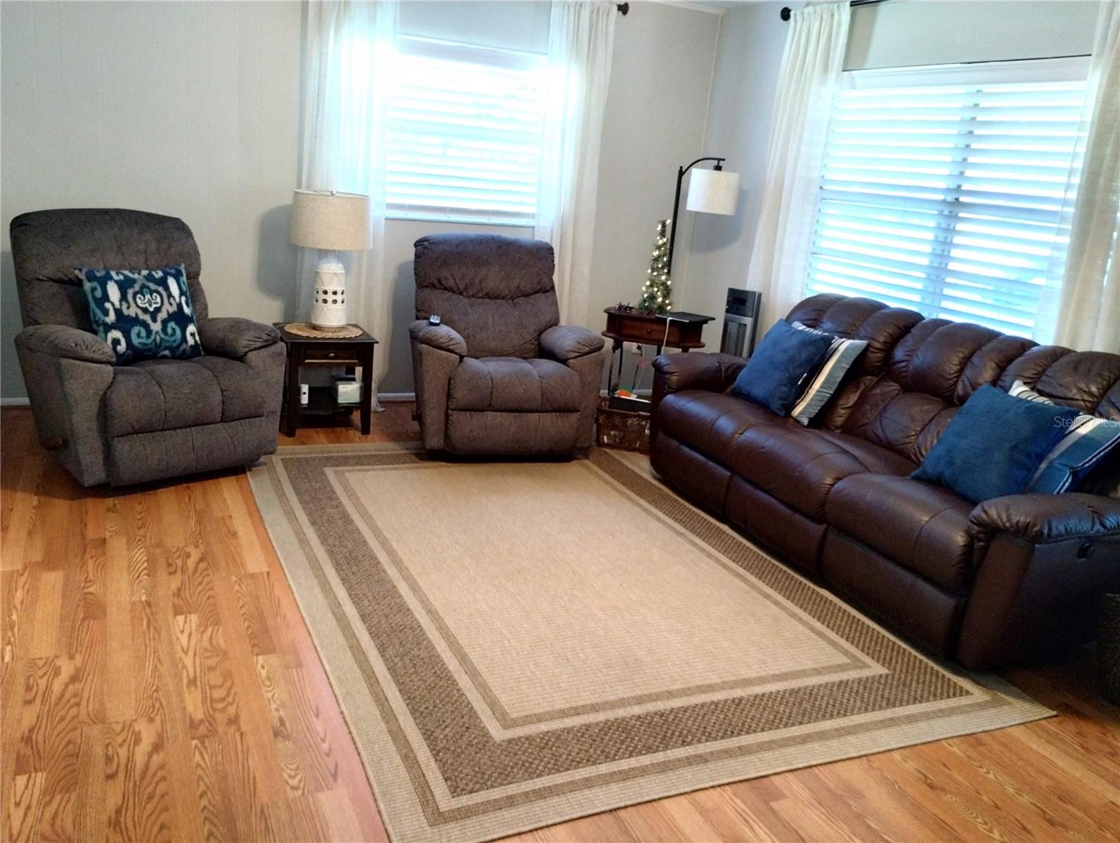 Spacious living room with wood laminate floors