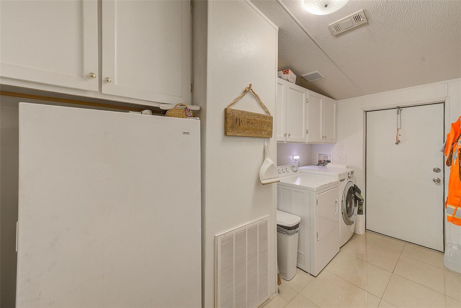 Laundry Room & Door to Screened Lanai