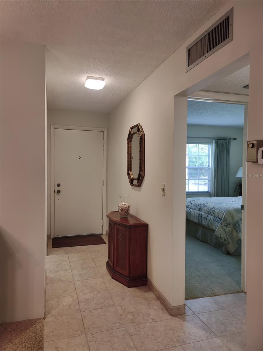 Entry and view of hallway to guest quarters.