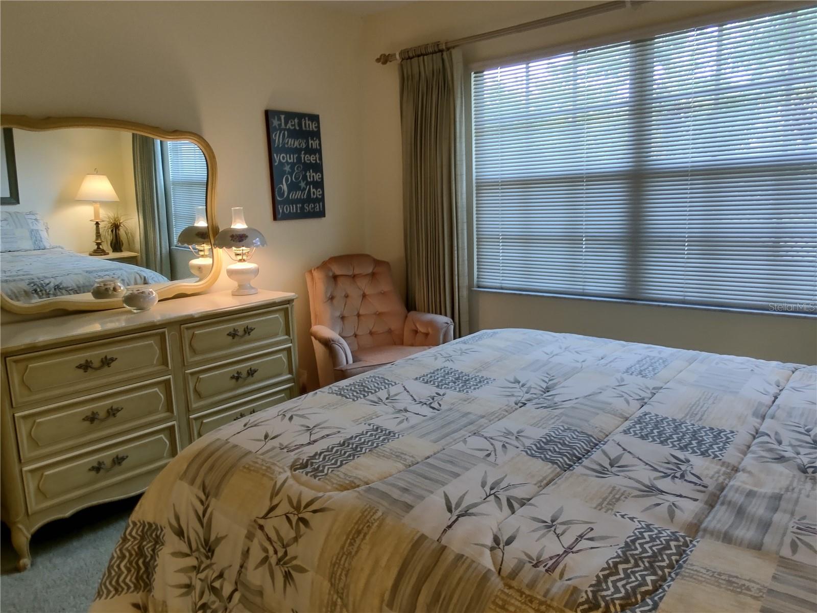 Large window fills guest bedroom with great natural light and airflow.