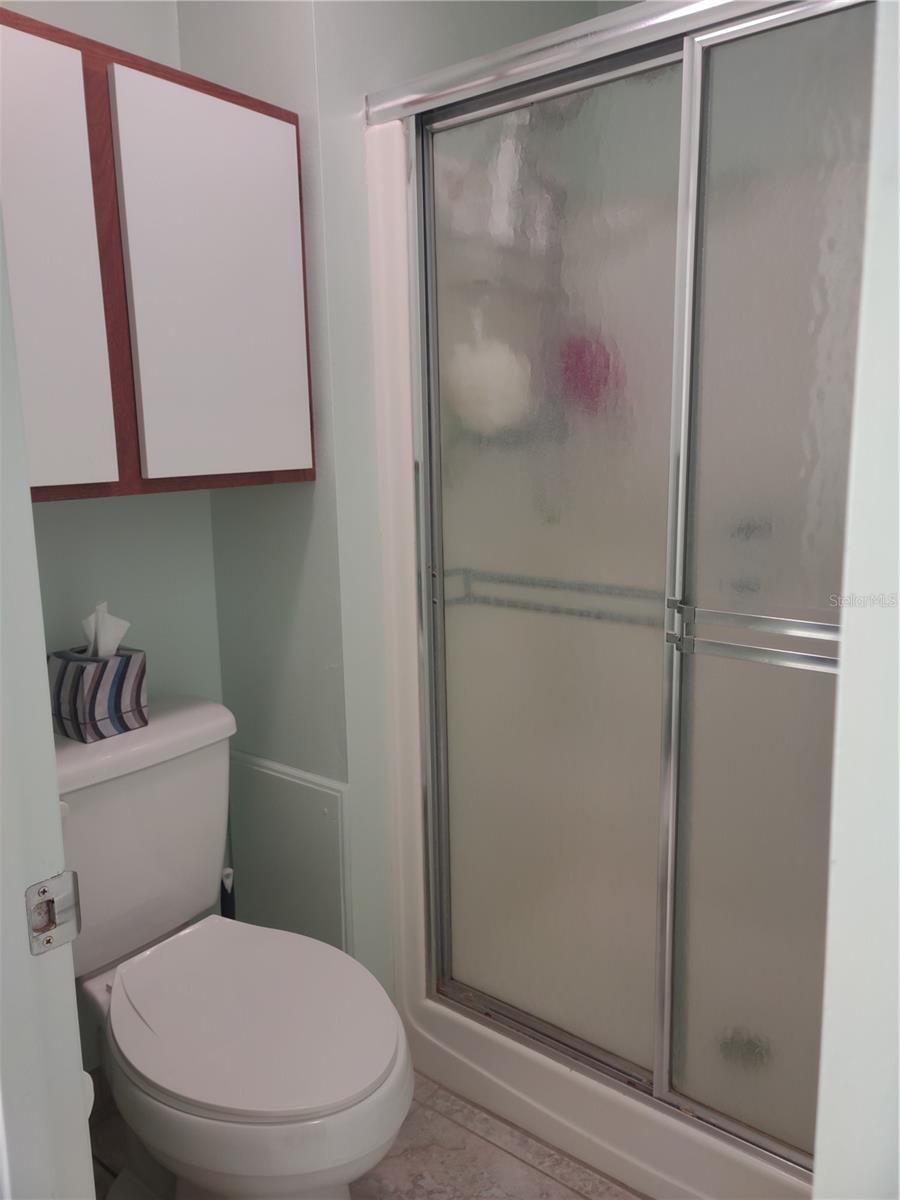 Updated commode and walk in shower in private wet room.