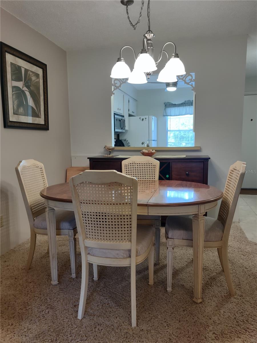 Dining room view of pass thru window to kitchen.