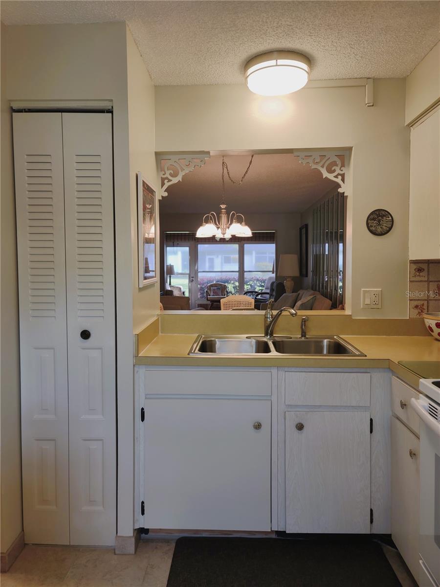 View of pantry and pass thru window into dining room.