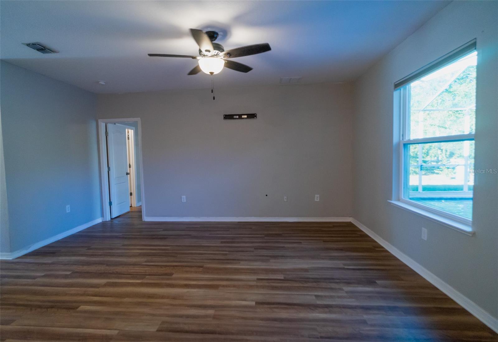 Living room showing entrance to principle bedroom.