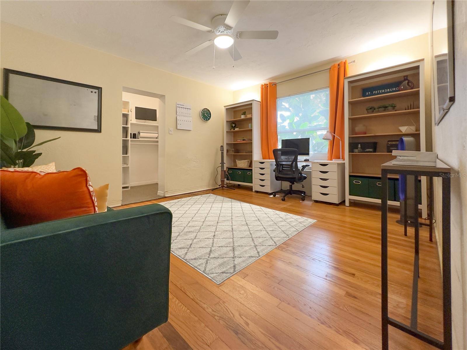 3rd Bedroom with original hardwood oak flooring and walk-in closet.