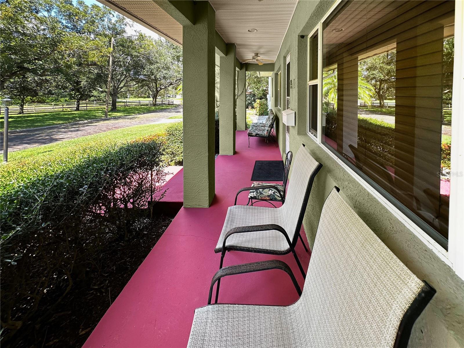 Great front porch with ceiling fans.