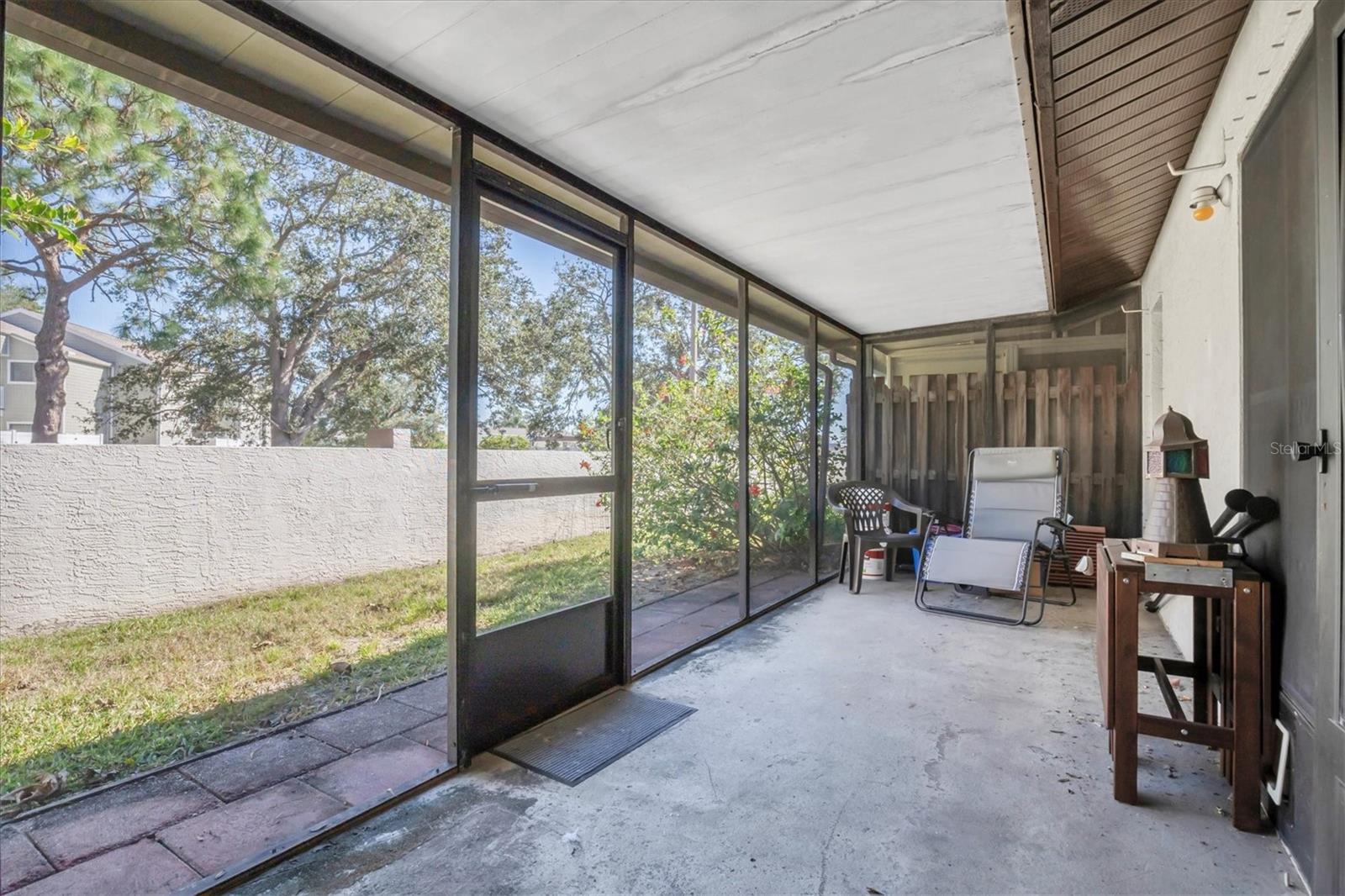 The back porch looks out at your own little back yard with a privacy wall that edges the outside of the community