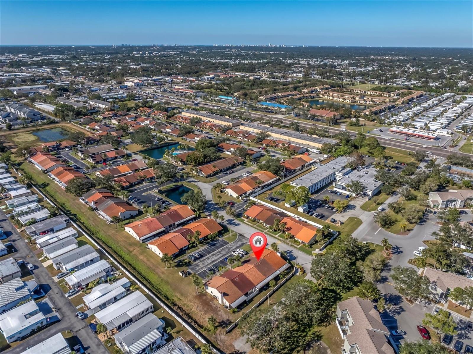 This view is northwest. You can see the Gulf shoreline at the top of the land on left side. The beaches are not far away!! You can again, also see the nice space of land and buildings between you and the busy Ulmerton Road. Convenience with peaceful living