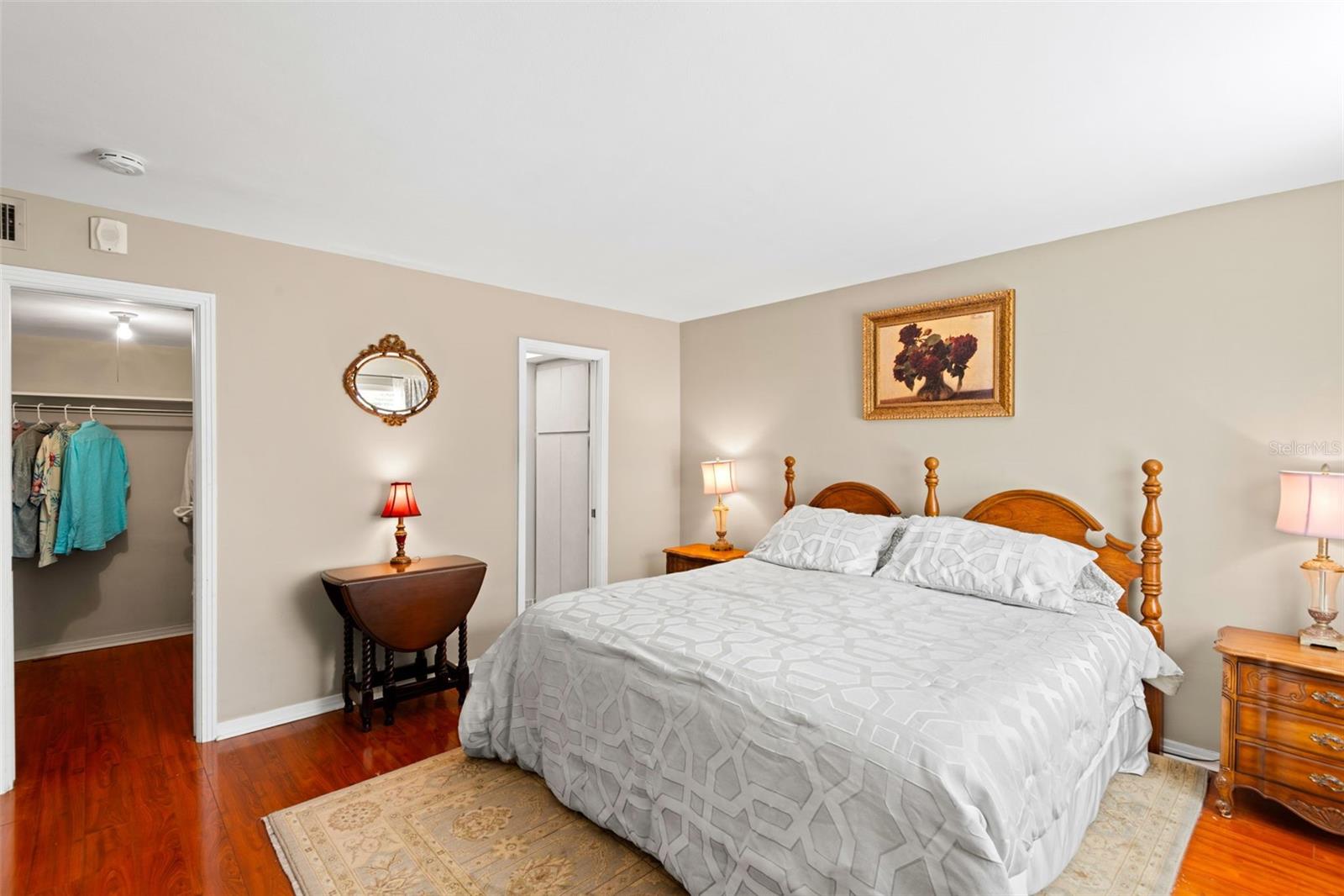 Primary bedroom with walk-in closet and ensuite bathroom with walk-in shower